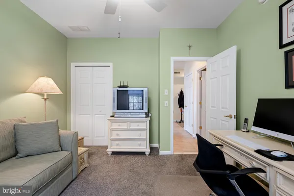 a view of a bathroom from a hallway