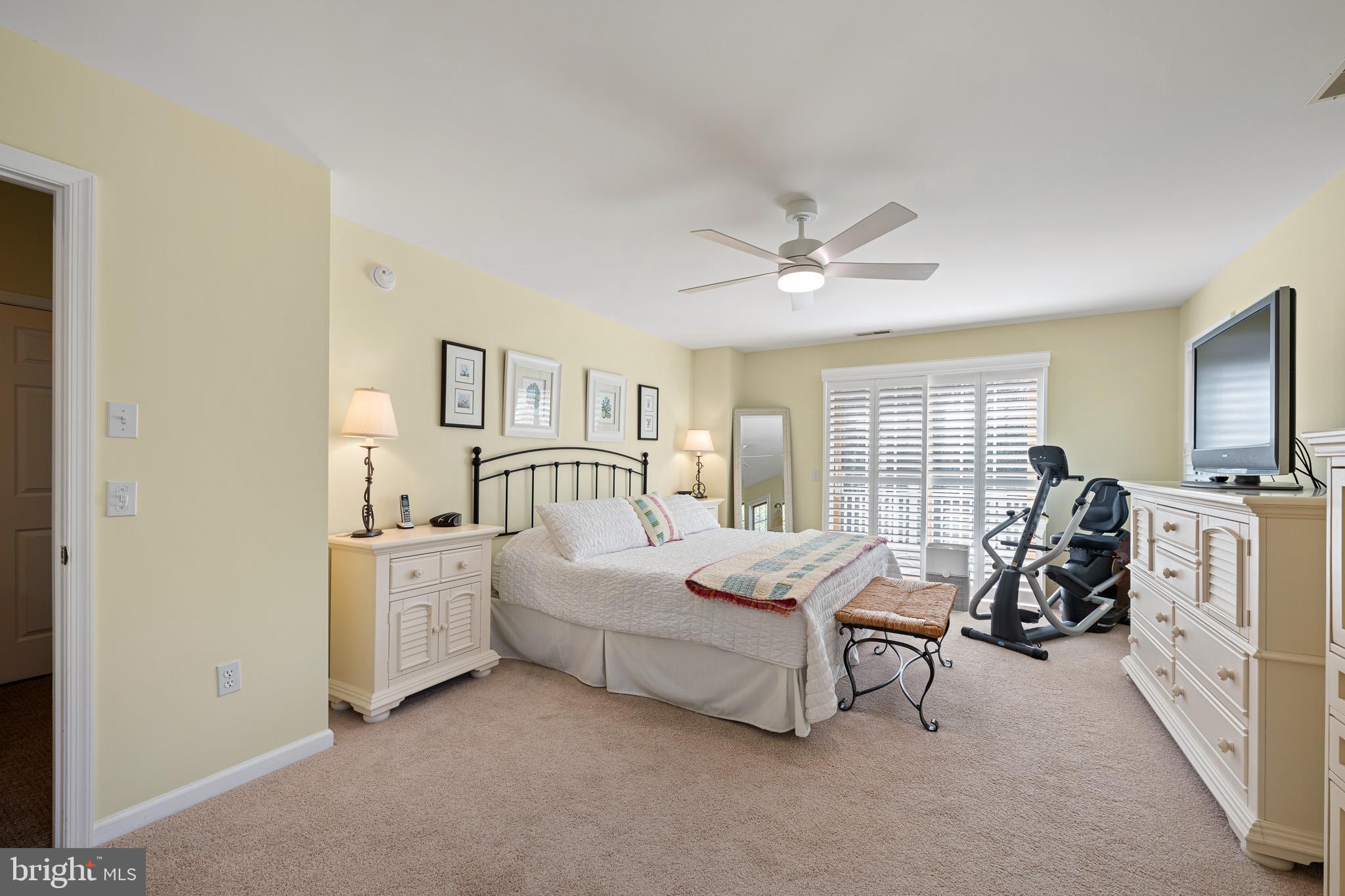 38744 Skipjack Village Road, Unit 14 Bethany Beach, DE 19930 - Photo 20 of 70 a bedroom with furniture and white walls