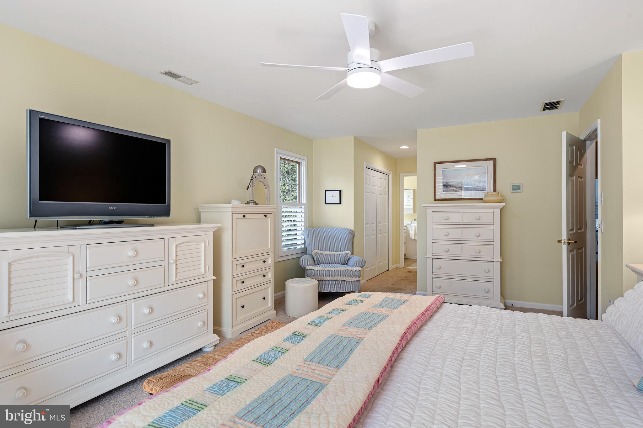 38744 Skipjack Village Road, Unit 14 Bethany Beach, DE 19930 - Photo 22 of 70 a bedroom with a bed and a flat screen tv