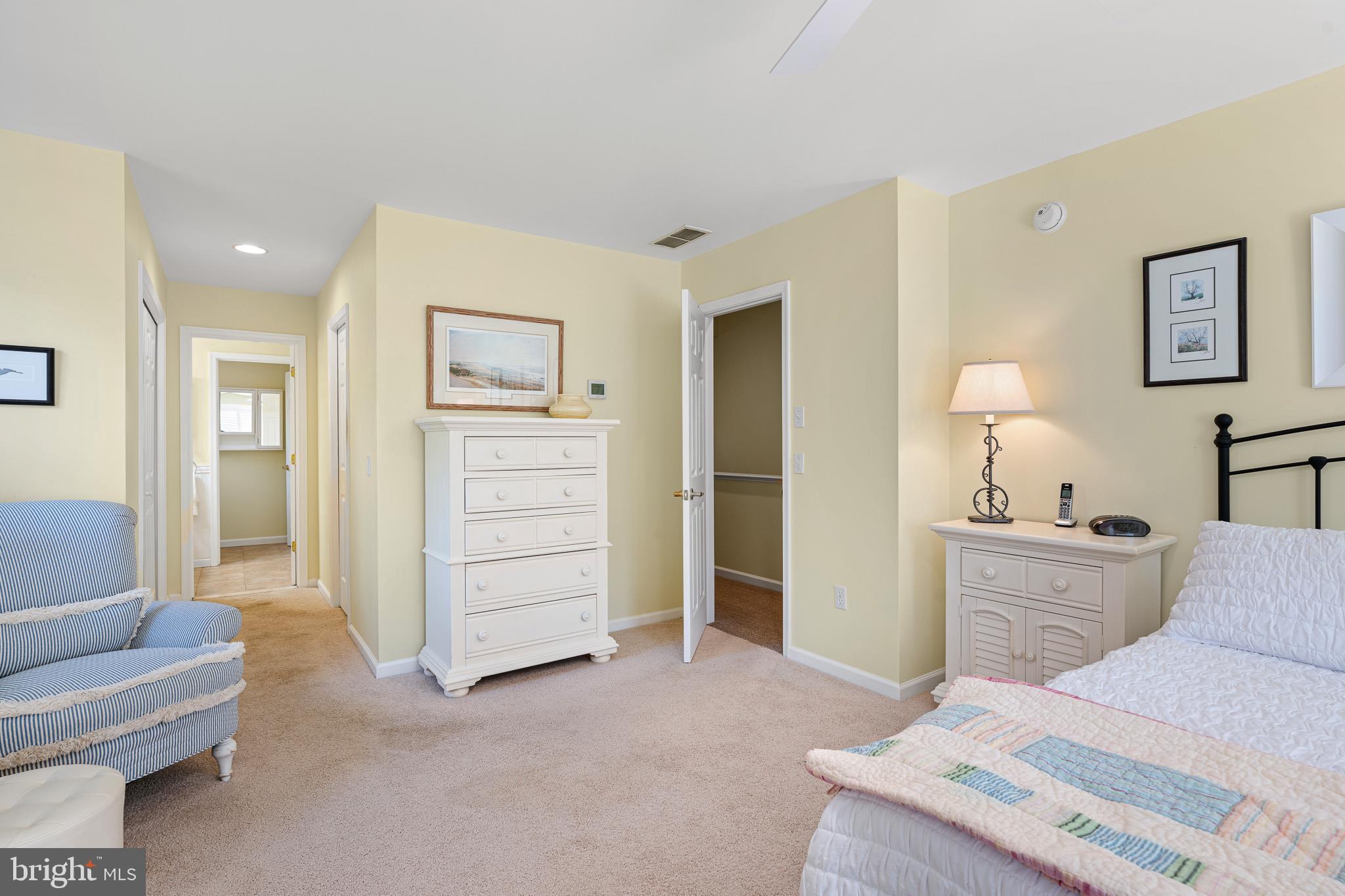 38744 Skipjack Village Road, Unit 14 Bethany Beach, DE 19930 - Photo 23 of 70 a bed room with a bed and furniture