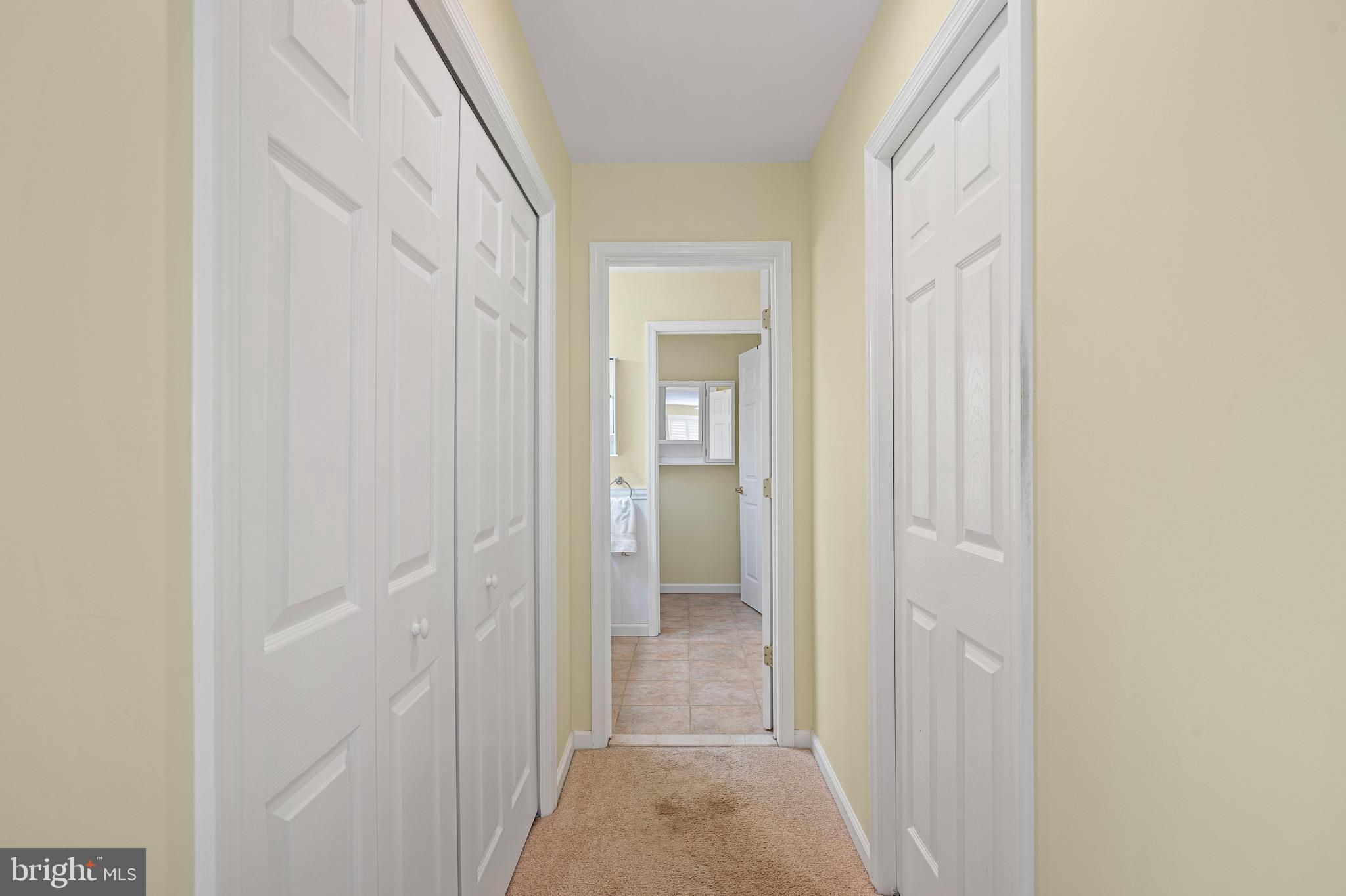 38744 Skipjack Village Road, Unit 14 Bethany Beach, DE 19930 - Photo 24 of 70 a view of a bathroom from a hallway
