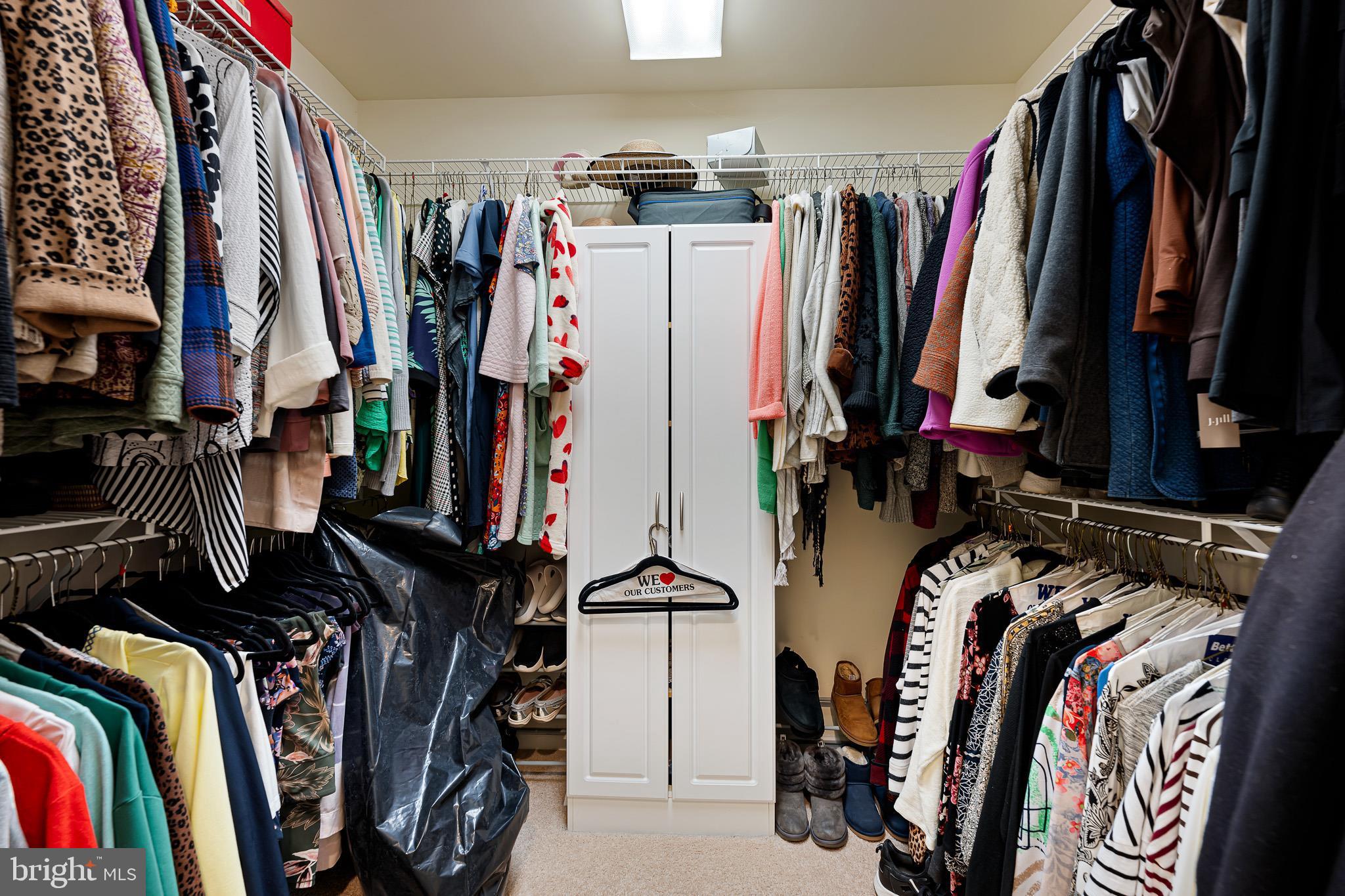 38744 Skipjack Village Road, Unit 14 Bethany Beach, DE 19930 - Photo 27 of 70 a view of walk in closet with clothes