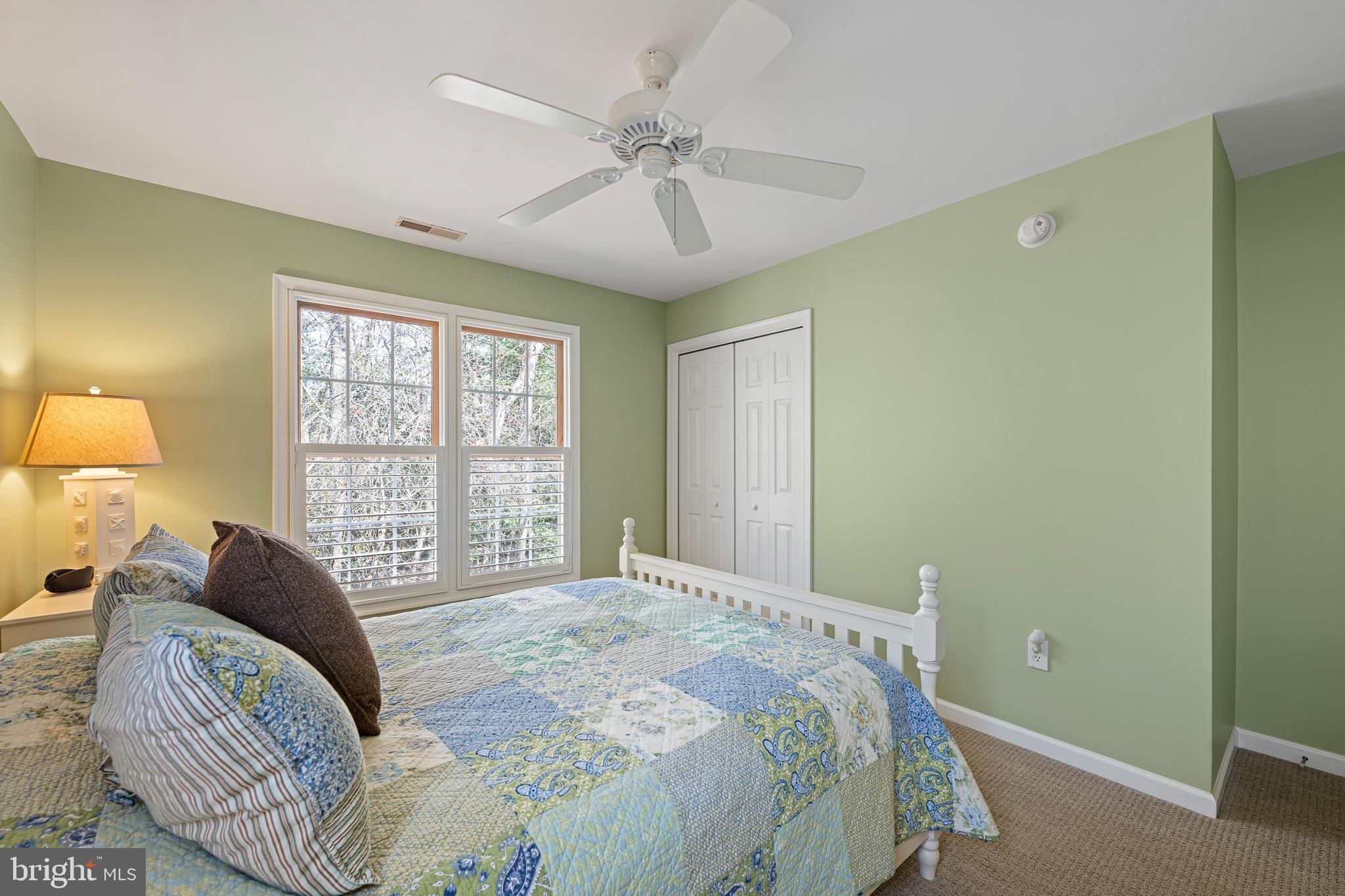 38744 Skipjack Village Road, Unit 14 Bethany Beach, DE 19930 - Photo 31 of 70 a bedroom with a large bed and a window