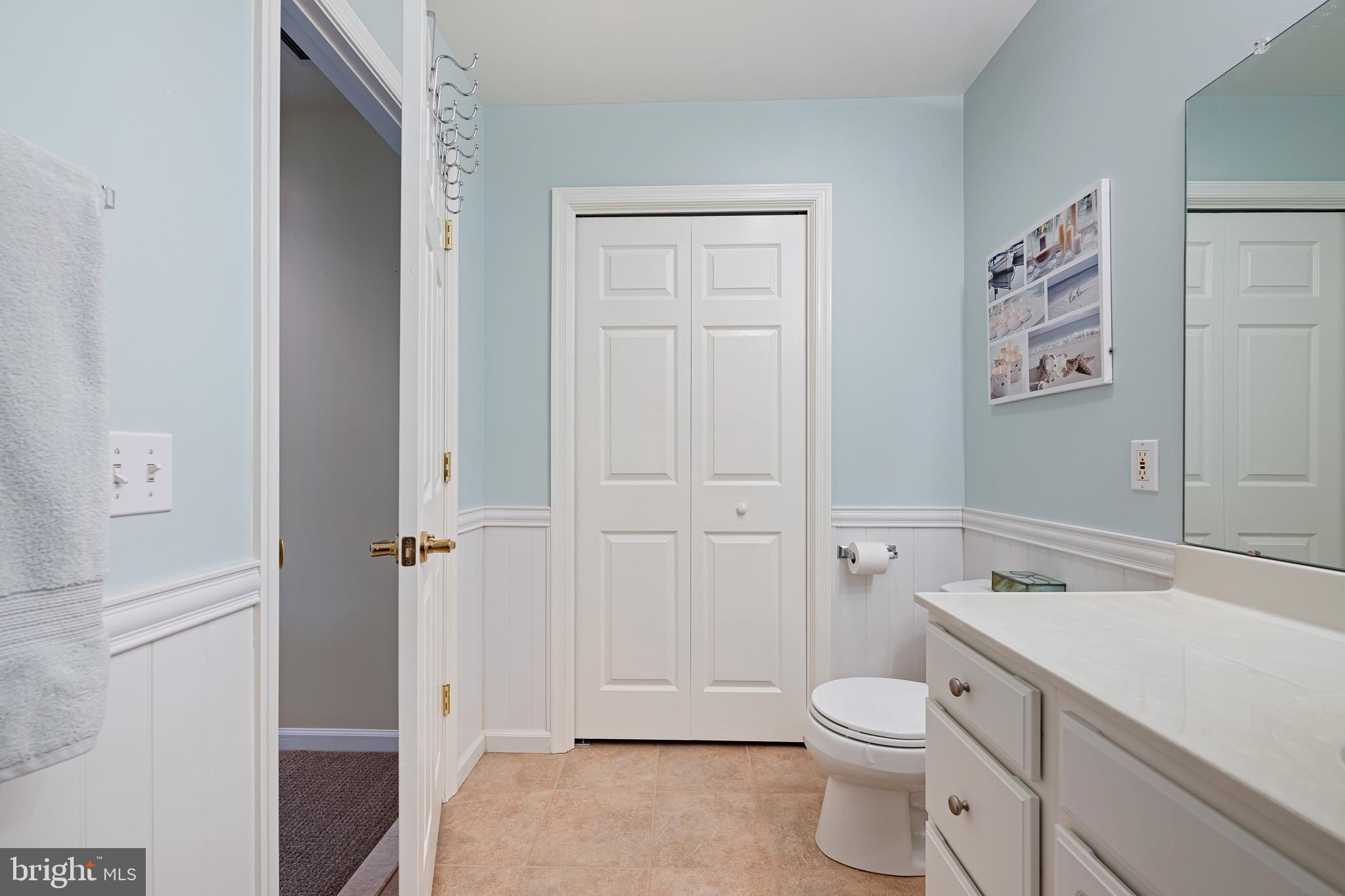 38744 Skipjack Village Road, Unit 14 Bethany Beach, DE 19930 - Photo 33 of 70 a bathroom with a toilet sink vanity and tub