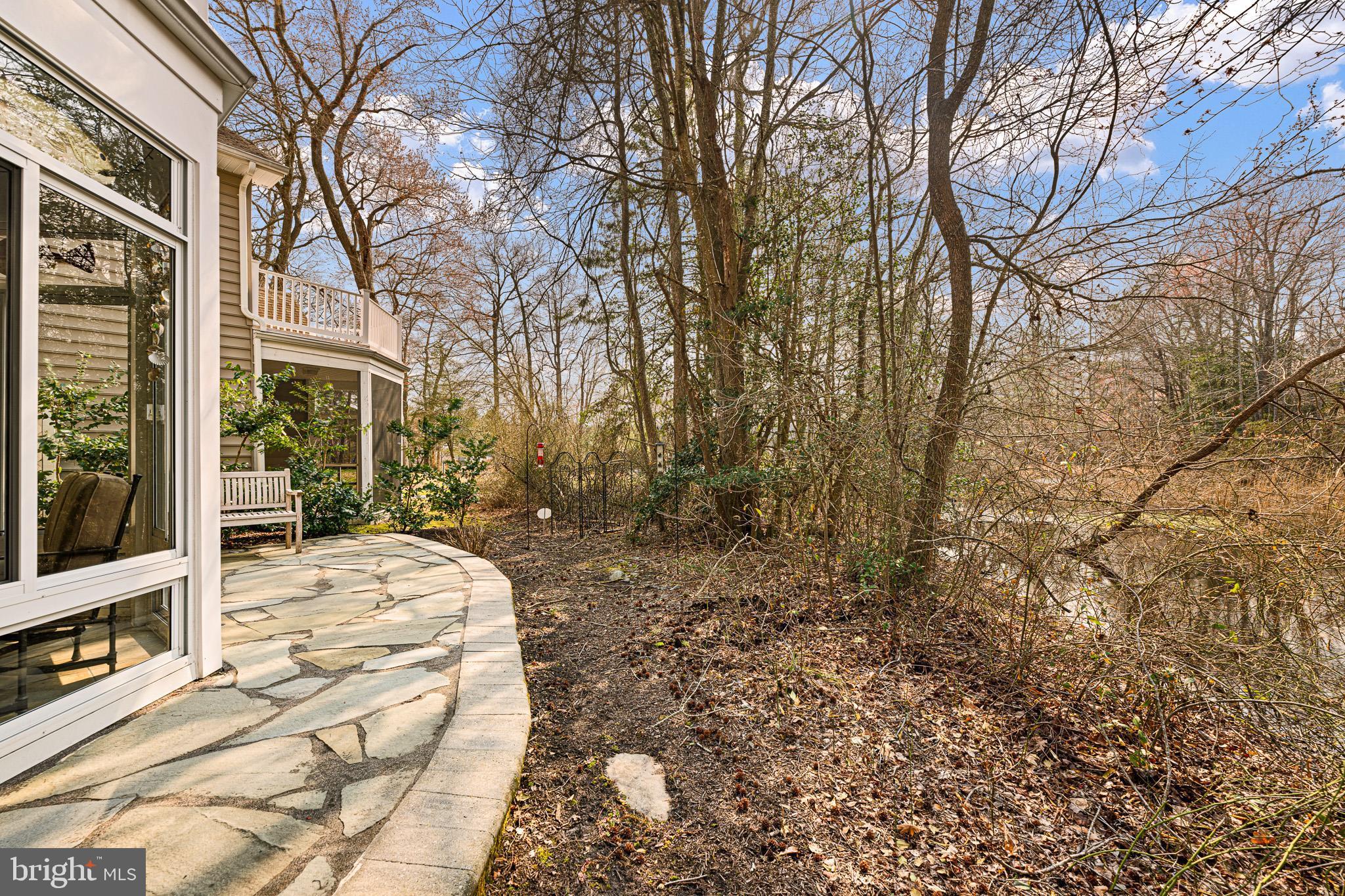 38744 Skipjack Village Road, Unit 14 Bethany Beach, DE 19930 - Photo 40 of 70 a view of a backyard with large trees