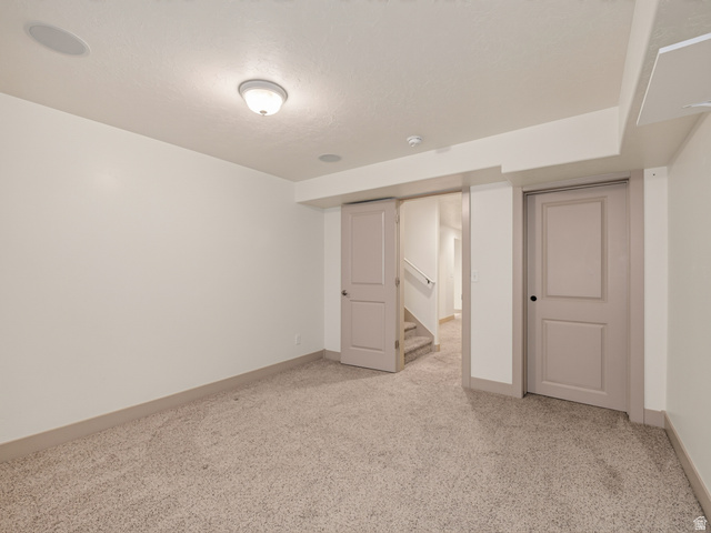 1279 West 1500th Street North Mapleton, UT 84664 - Photo 53 of 83 Carpeted room featuring light-colored walls and baseboards