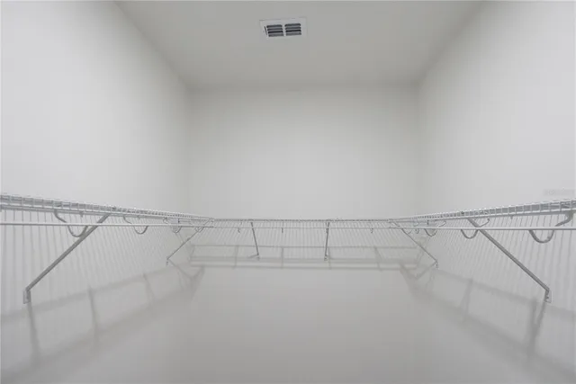 a view of a room with racks on the wall