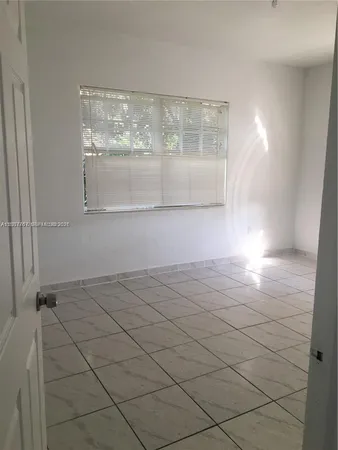 a view of empty room with window