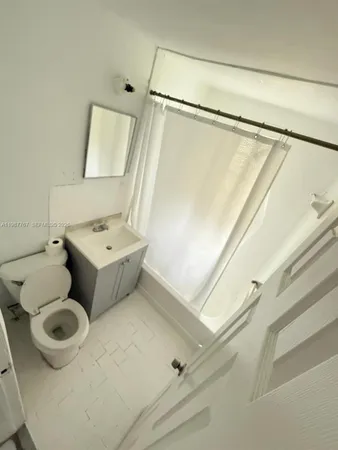 a bathroom with a sink and toilet