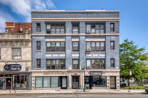 a front view of a building with a street