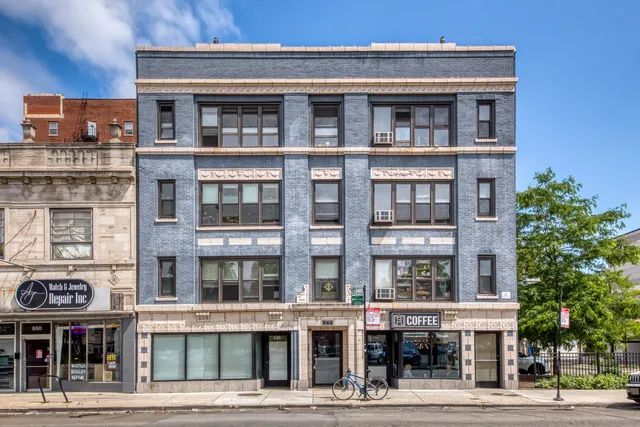 a front view of a building with a street