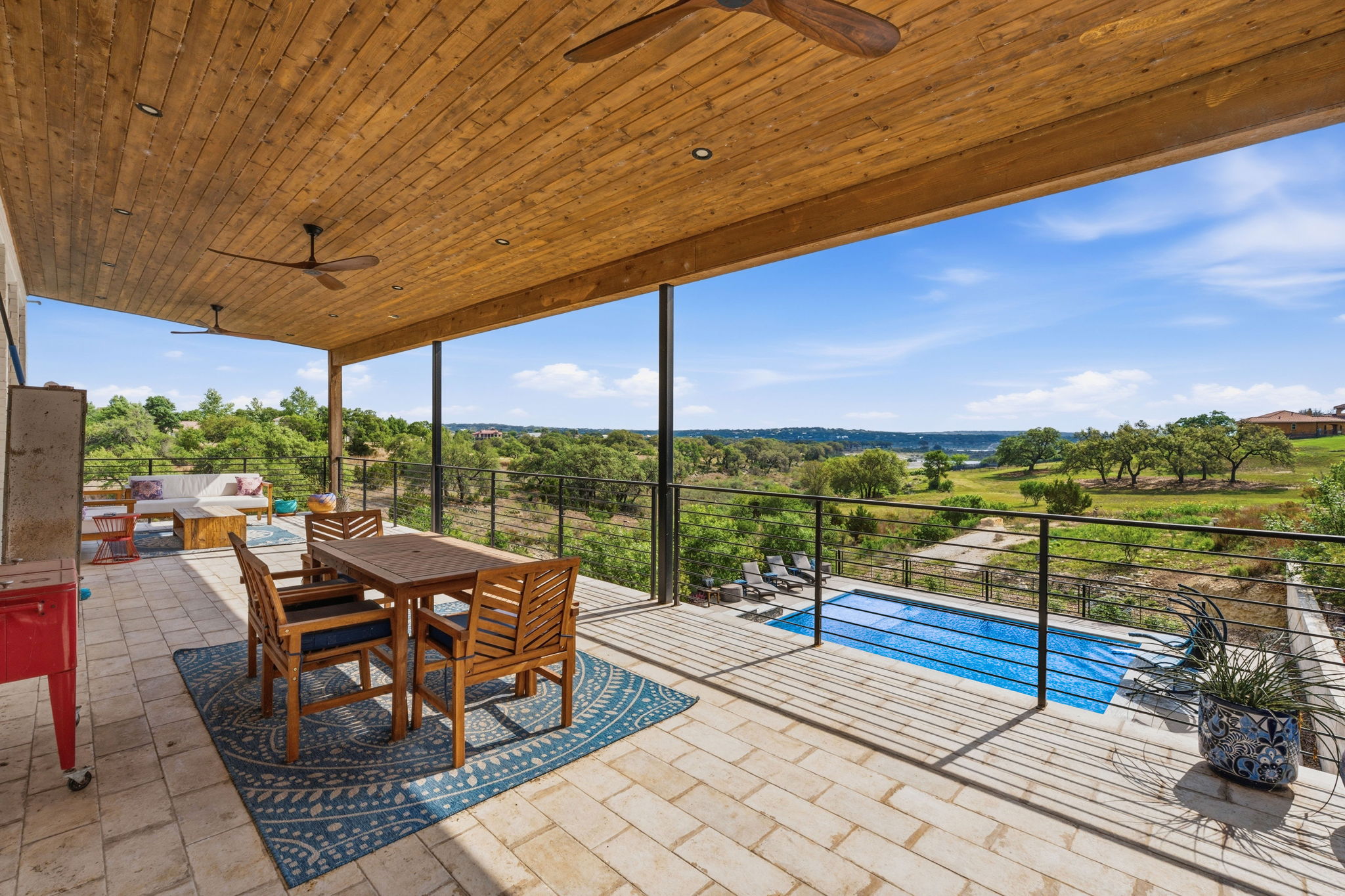 194 Placid Way Spring Branch, TX 78070 - Photo 28 of 37 Covered outdoor patio featuring a wood-finish ceiling, dual ceiling fans, and paver flooring