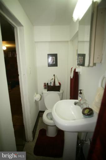 1022 Upnor Road Baltimore, MD 21212 - Photo 8 of 20 a bathroom with a sink and a toilet