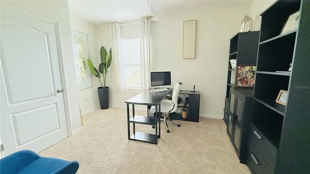 a bedroom with a bed and the couch