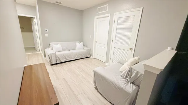 a bedroom with a bed and a table in it