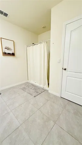 a view of a patio with a dining table and chairs