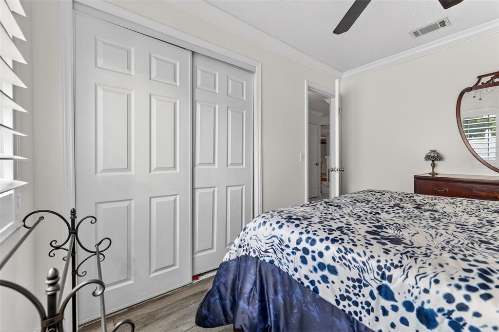 575 Tiberon Cove Road Longwood, FL 32750 - Photo 28 of 56 a bedroom with a bed and a window