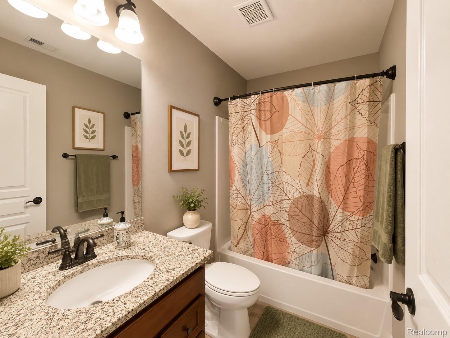 915 Barclay Circle Rochester, MI 48307 - Photo 11 of 14 Bathroom featuring a vanity with a granite countertop, undermount sink, and oil-rubbed bronze faucet