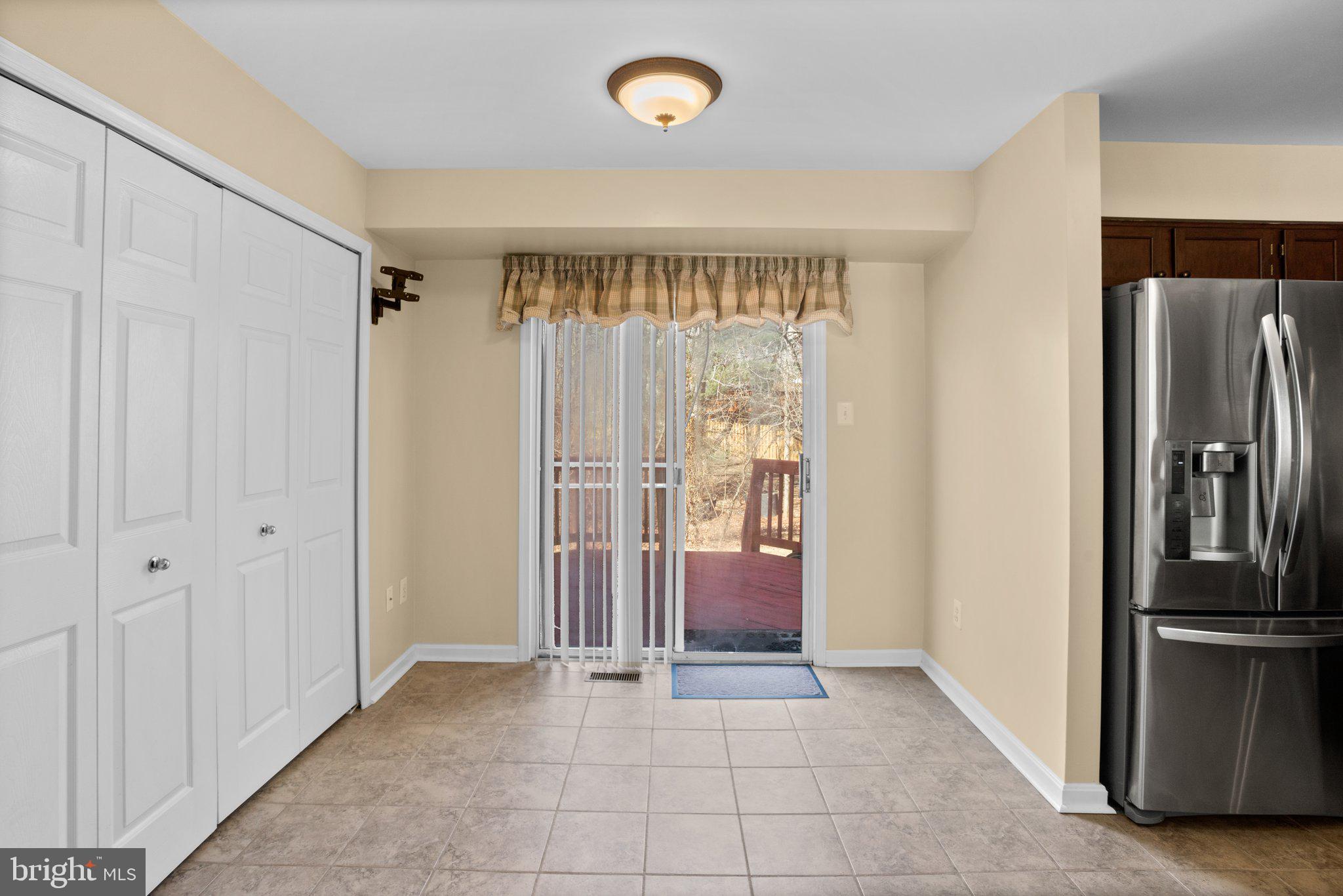 6342 Arbor Way Elkridge, MD 21075 - Photo 18 of 30 a view of a kitchen with furniture and a refrigerator