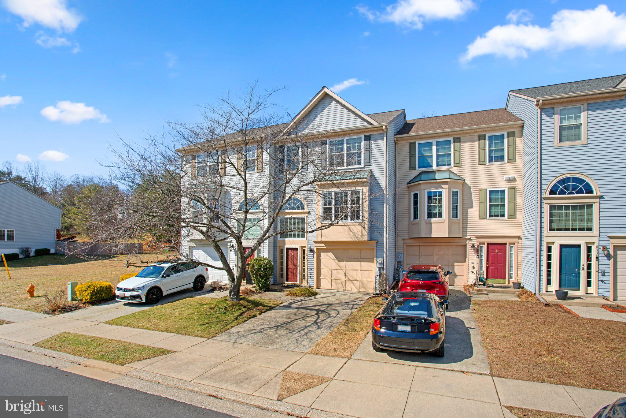 6342 Arbor Way Elkridge, MD 21075 - Photo 2 of 30 a front view of a residential houses with yard and trees