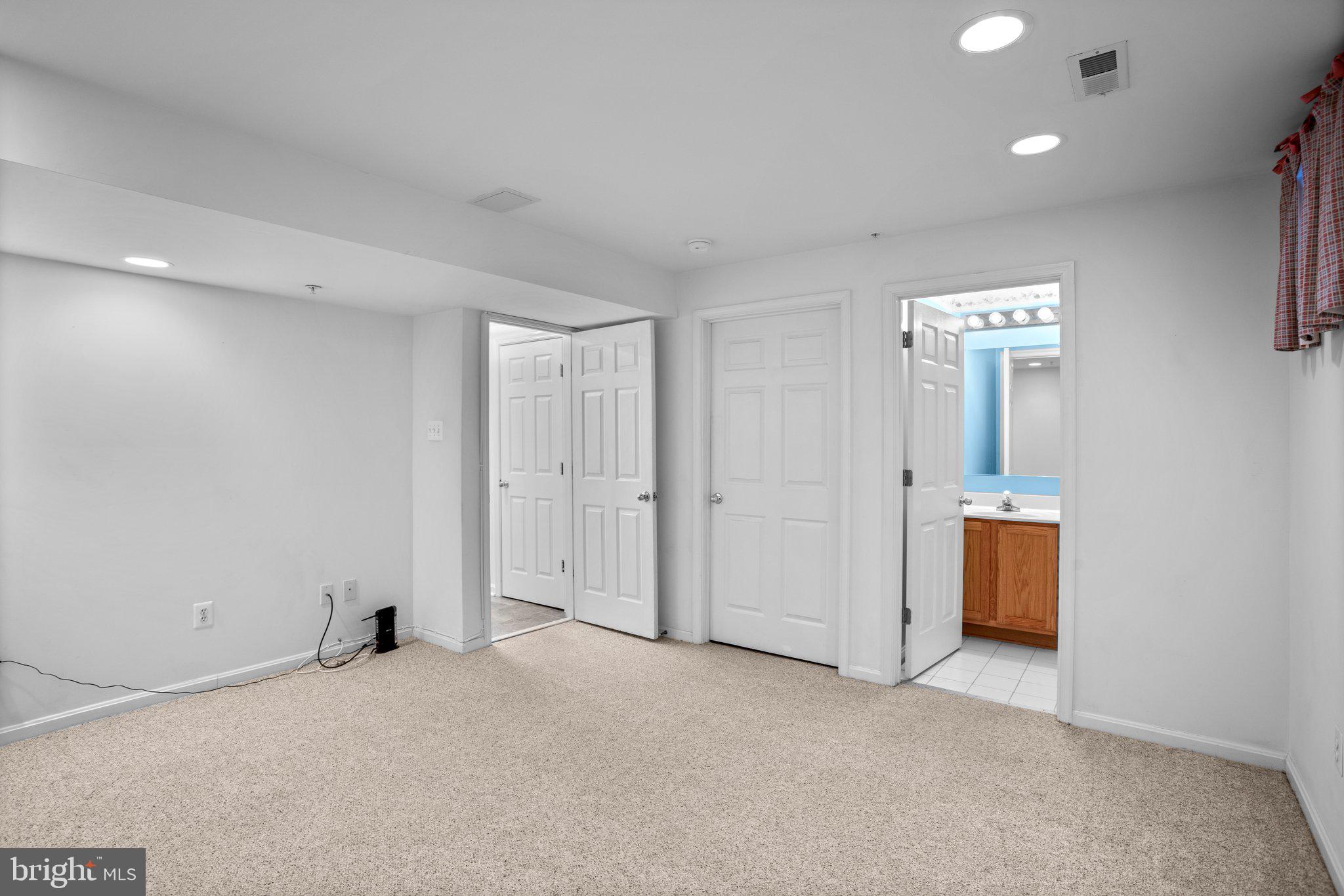 6342 Arbor Way Elkridge, MD 21075 - Photo 6 of 30 an empty room with closet and wooden floor