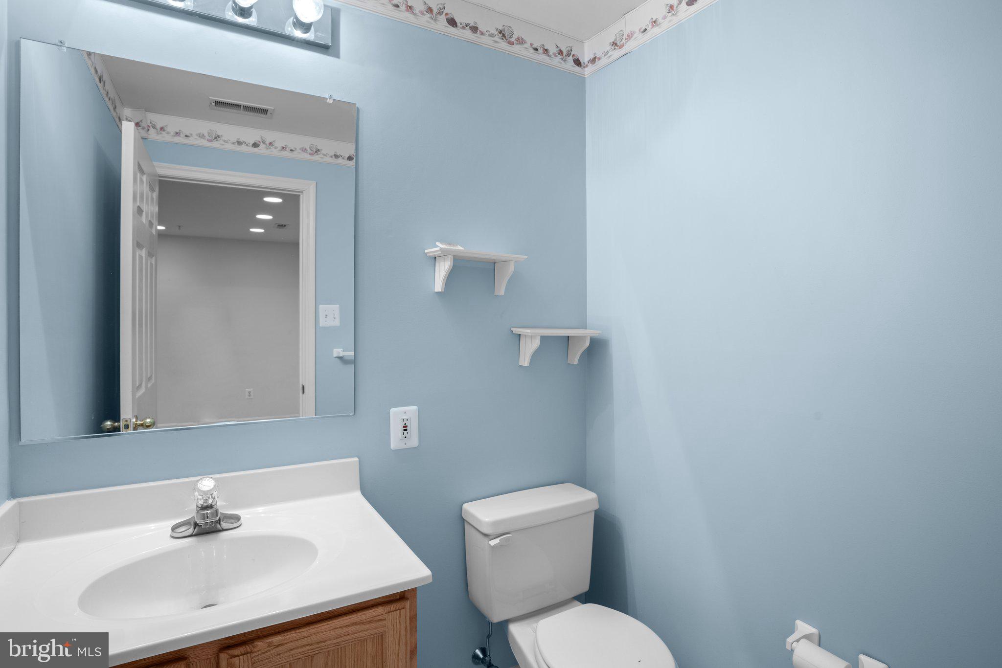 6342 Arbor Way Elkridge, MD 21075 - Photo 9 of 30 a bathroom with a sink mirror and toilet