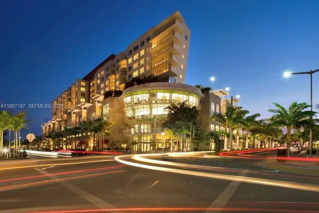 a view of a street with a building in the background