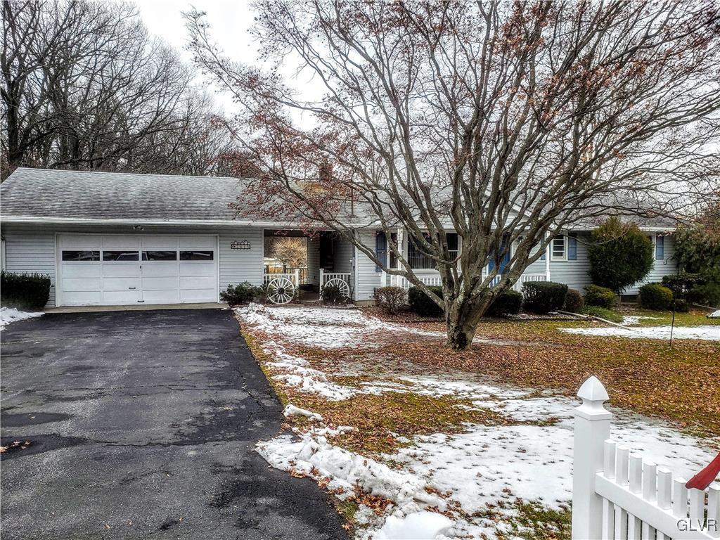 2415 Yost Road Bath, PA 18014 - Photo 3 of 30 a view of a house with a yard covered in snow