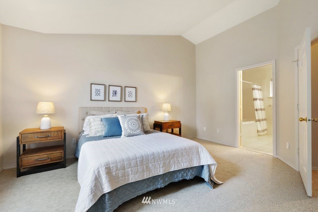 22611 4th Avenue West, Unit 103 Bothell, WA 98021 - Photo 14 of 25 a bedroom with a bed and a lamp