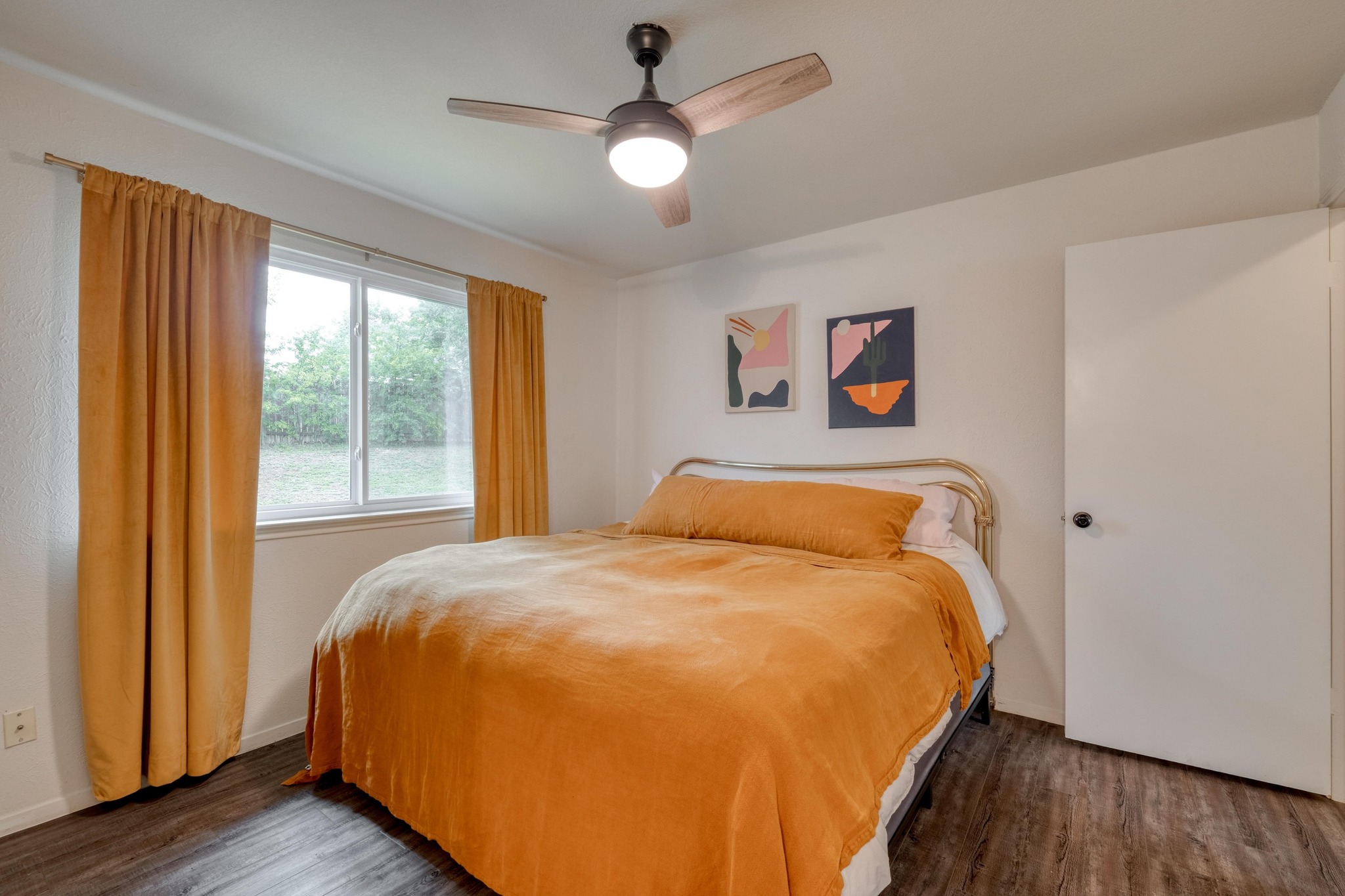 12030 Rotherham Drive Austin, TX 78753 - Photo 13 of 19 Primary bedroom shines with natural light, a ceiling fan, and stylish modern touches.