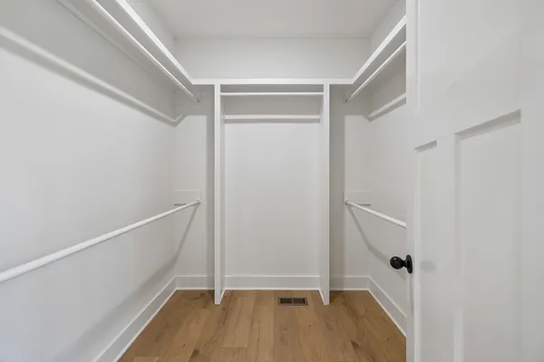 a view of an empty walk in closet