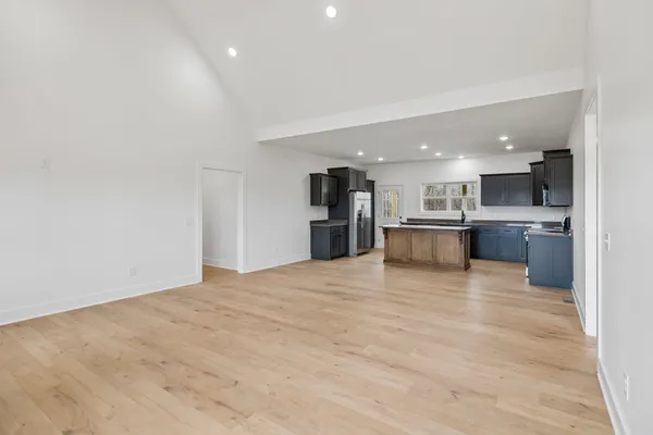 a view of kitchen and kitchen with a sink