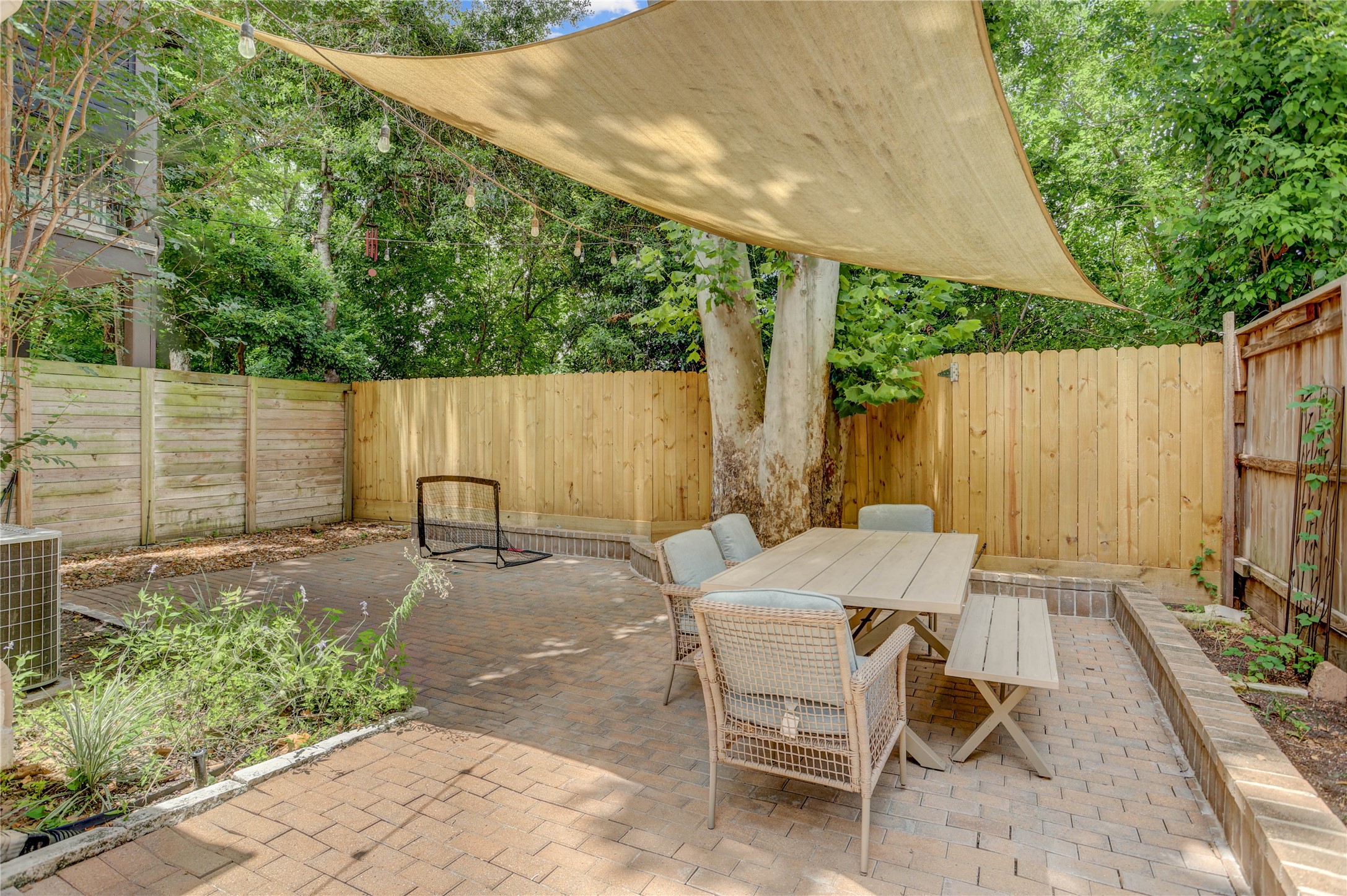 4262 Childress Street, Unit B Houston, TX 77005 - Photo 21 of 22 a patio with table and chairs