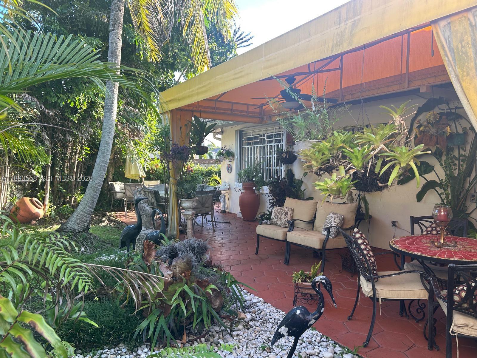 7891 Southwest 162nd Court Miami, FL 33193 - Photo 14 of 19 a view of a chairs and table in a patio
