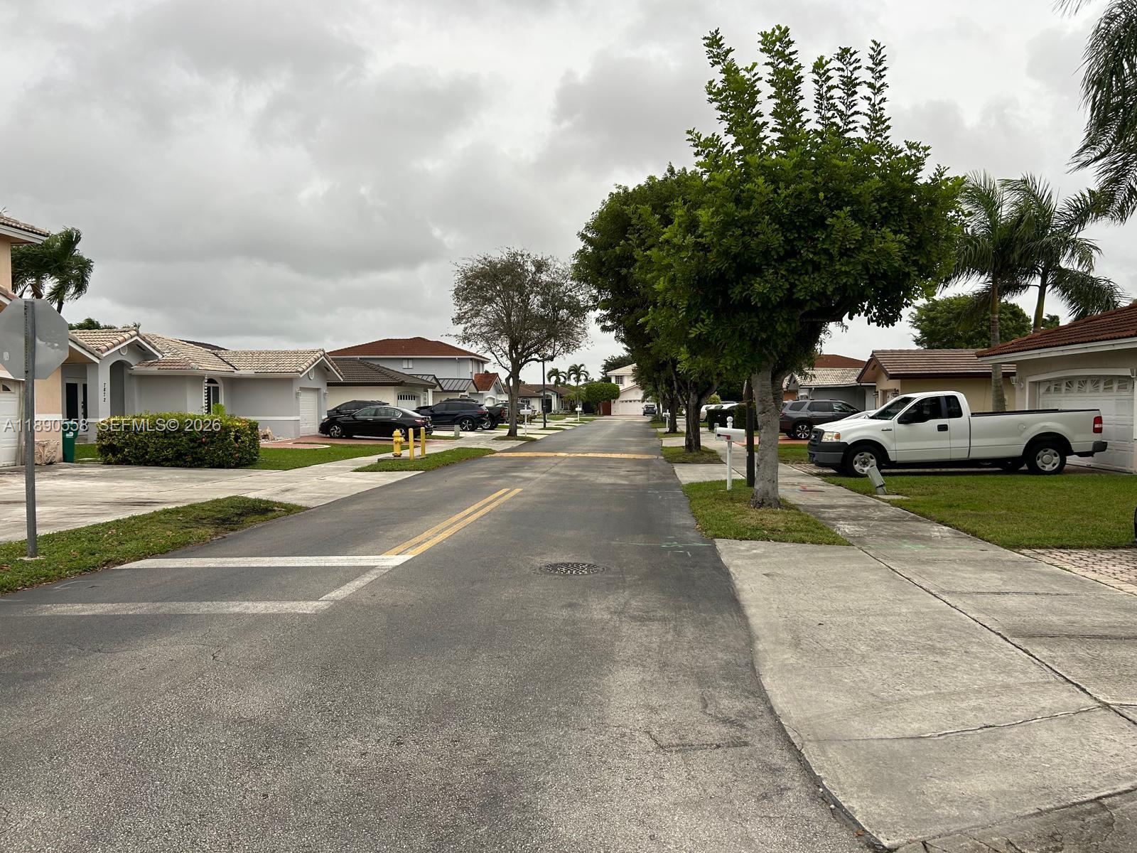 7891 Southwest 162nd Court Miami, FL 33193 - Photo 19 of 19 a view of street with parked cars