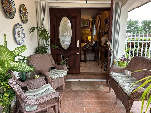 a living room with furniture and a clock