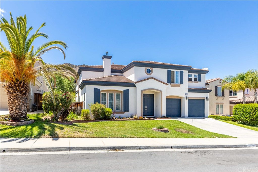 23375 Toronja Corte Corona, CA 92883 - Photo 1 of 1 a front view of a house with a garden