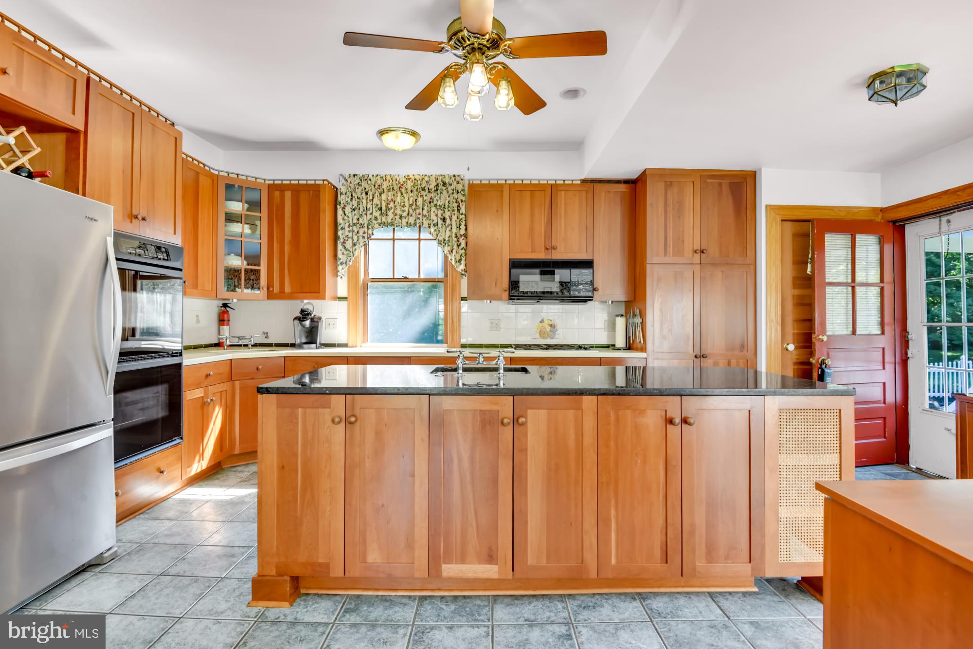 1015 Windsor Road Baltimore, MD 21208 - Photo 13 of 27 Island w/ granite top & stainless Refrigerator