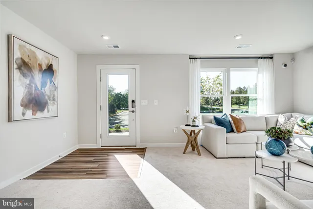 a living room with furniture and window