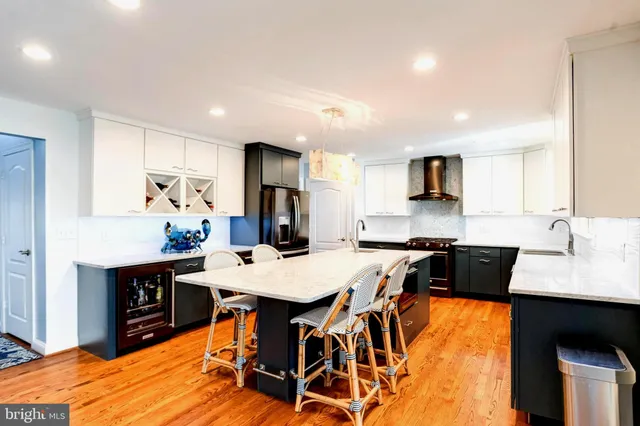a living room with furniture fireplace and a large window