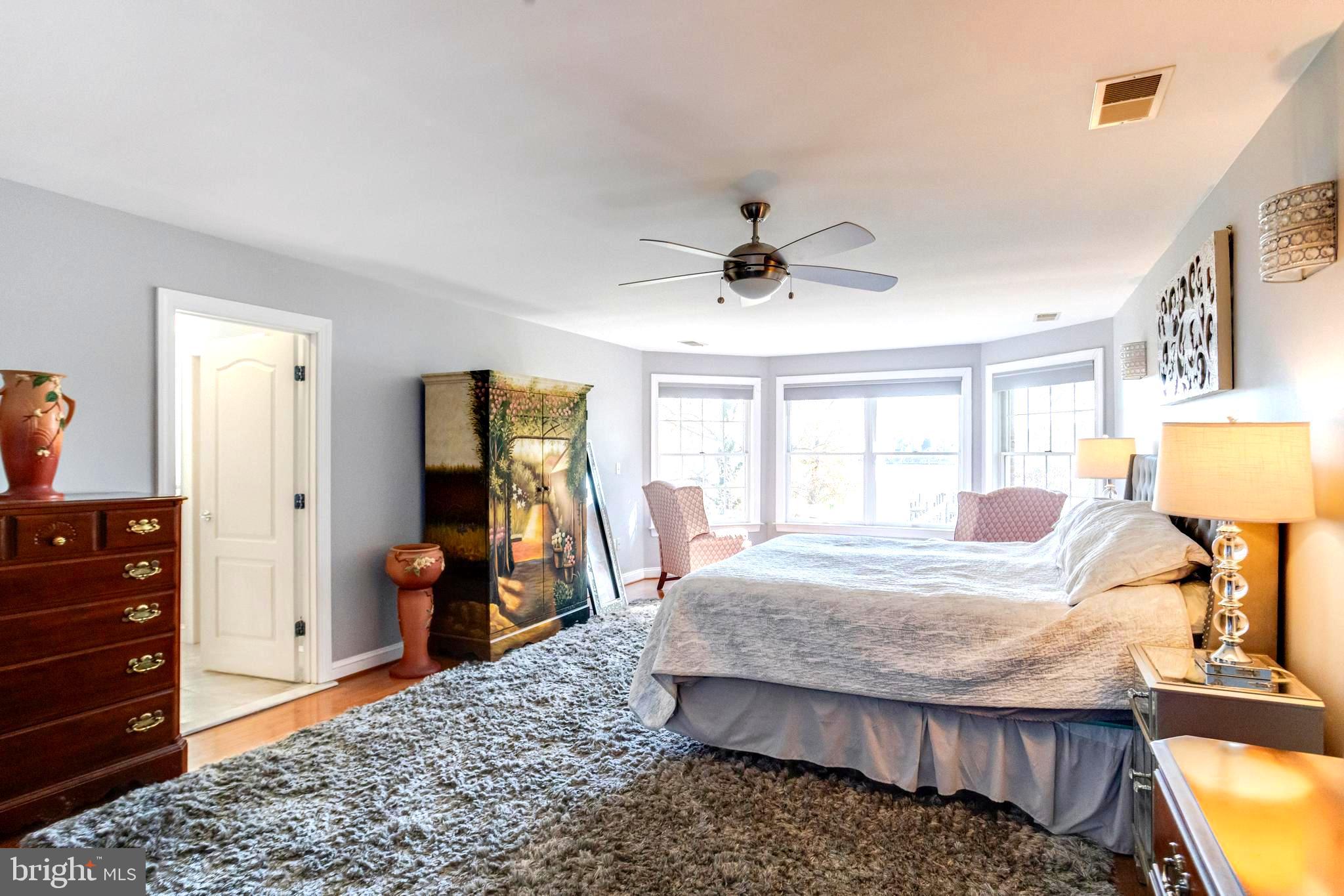 1432 Shore Road Baltimore, MD 21220 - Photo 27 of 63 a bedroom with a bed and wooden floor