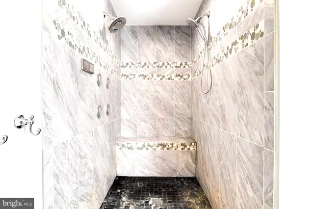 a view of a street with wooden fence