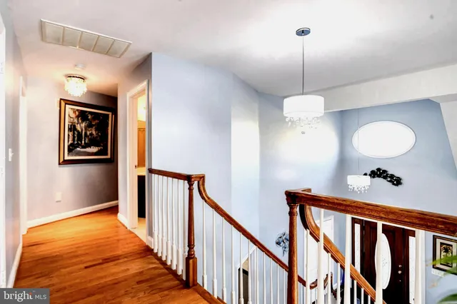 a view of a chairs and table on the wooden deck