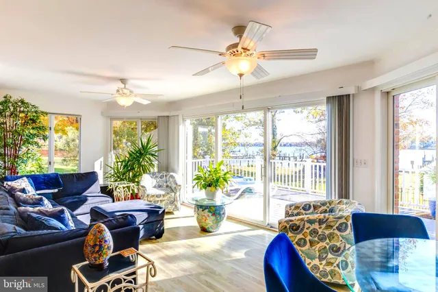 a view of a lake with table and chairs