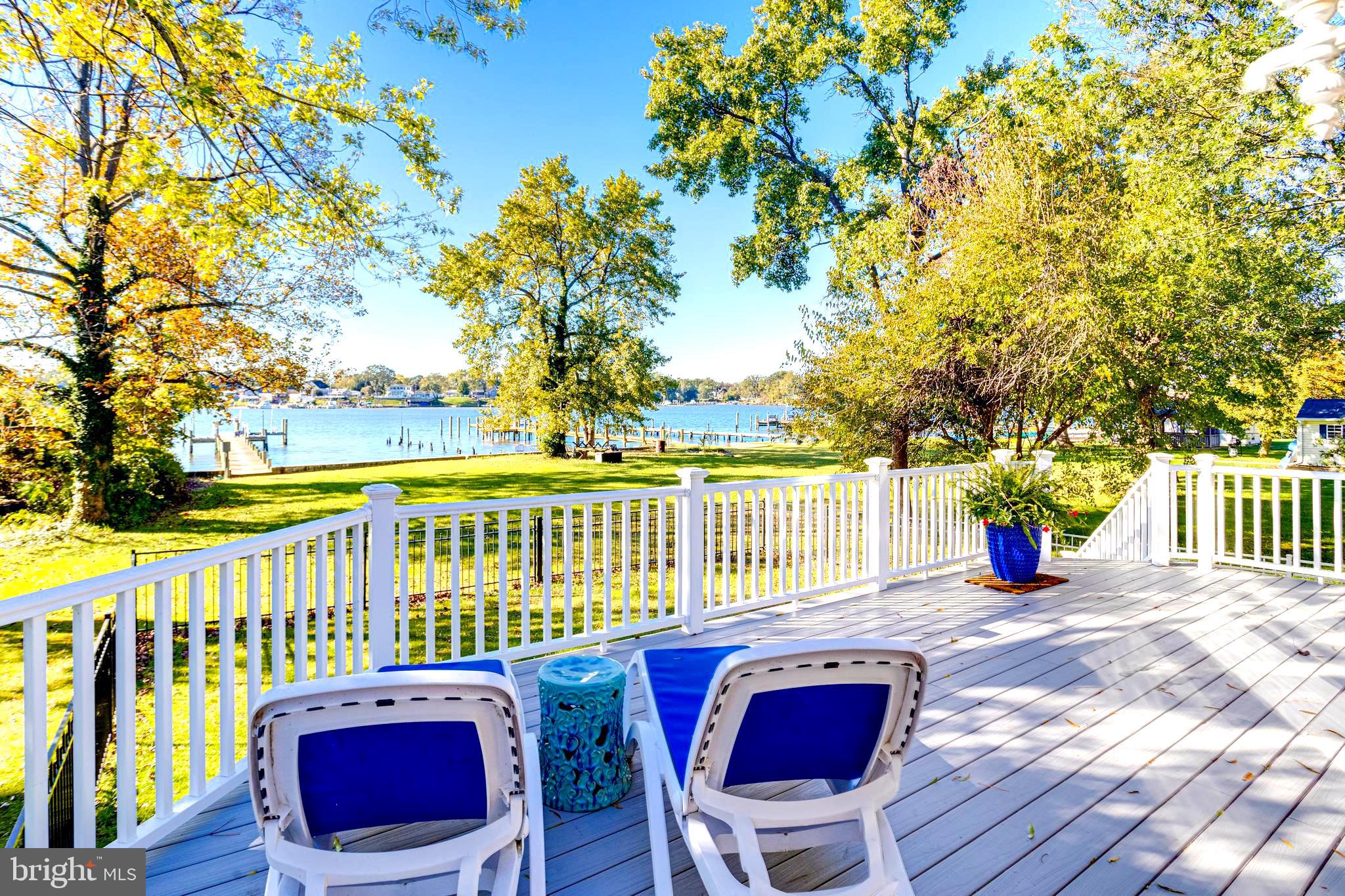 1432 Shore Road Baltimore, MD 21220 - Photo 49 of 63 a view of a chairs and table on the wooden deck