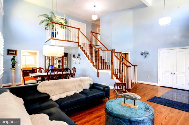 a living room with furniture fireplace and a table