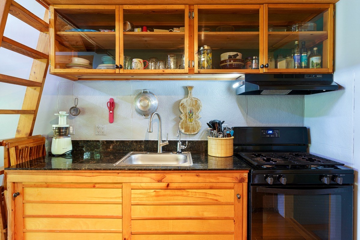 4680 Apopo Road Kapaa, HI 96746 - Photo 11 of 20 a kitchen with stainless steel appliances granite countertop stove and oven