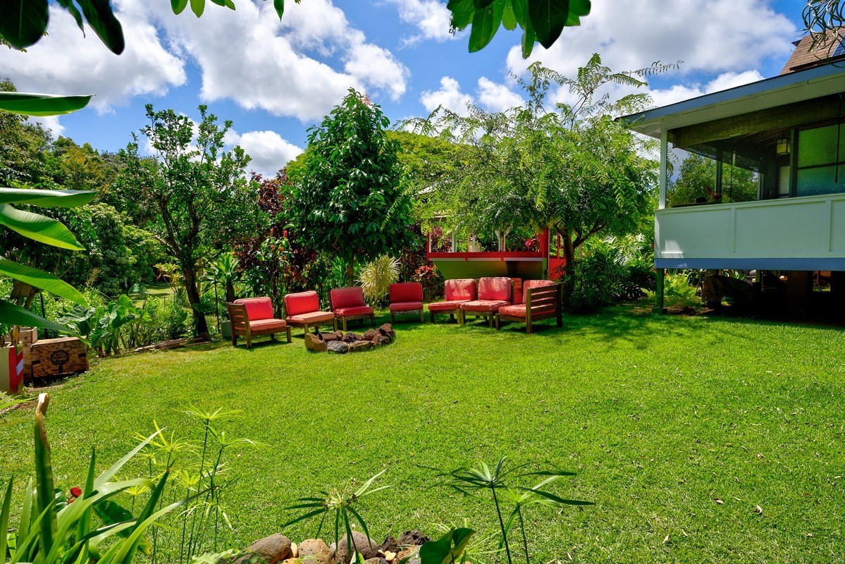 4680 Apopo Road Kapaa, HI 96746 - Photo 19 of 20 a backyard of a house with lots of green space and fountain