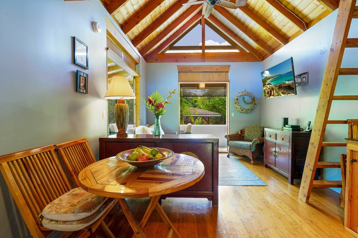 4680 Apopo Road Kapaa, HI 96746 - Photo 8 of 20 a view of a dining room with furniture and wooden floor