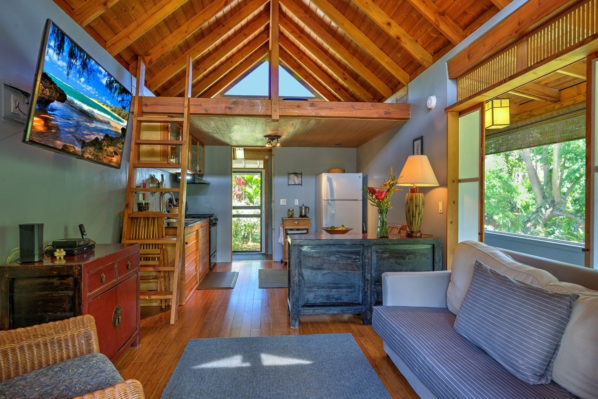 4680 Apopo Road Kapaa, HI 96746 - Photo 9 of 20 a living room with furniture and a fireplace